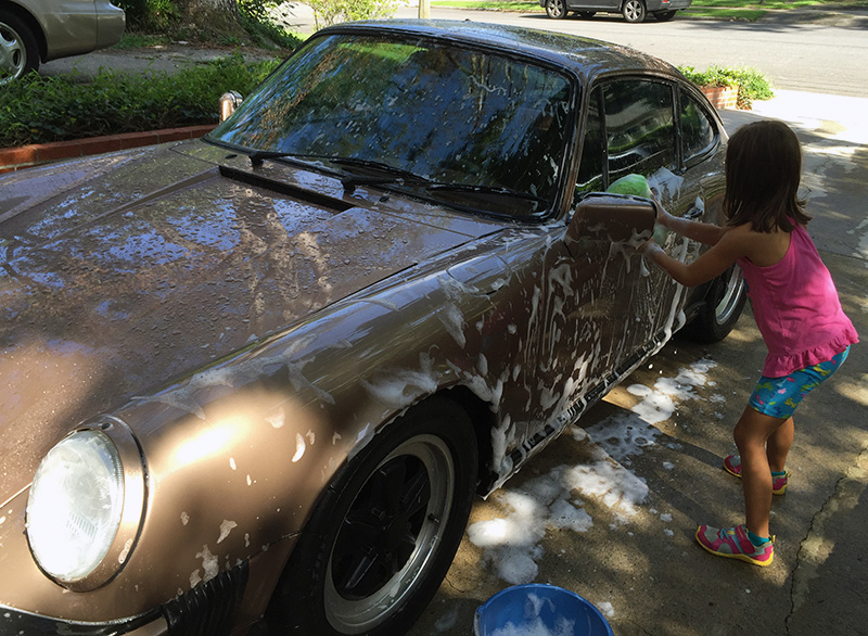 Lyla helping washing the car